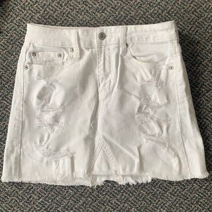 Distressed white jean skirt